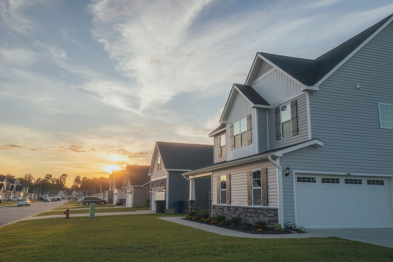 A street of new homes in a Miami Valley neighborhood at sunset