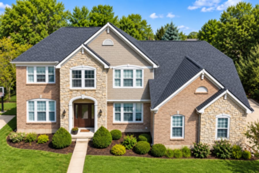 Brick and stone two-story home with a new charcoal shingle roof